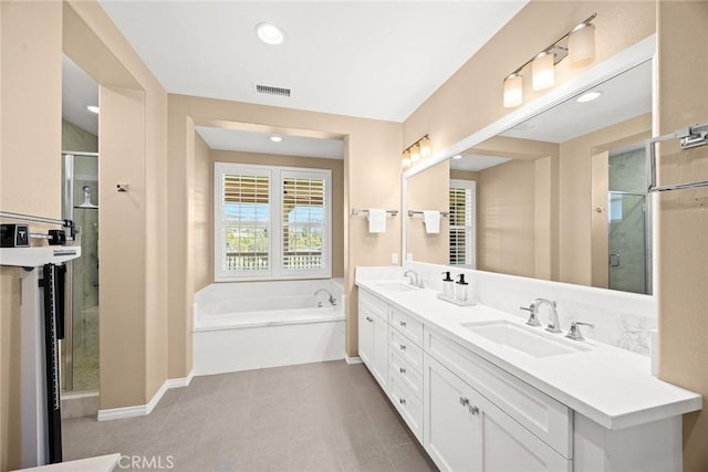 1252 N Lindley St, Azusa, CA 91702 - full bathroom with a garden tub, double vanity, a stall shower, and recessed lighting
