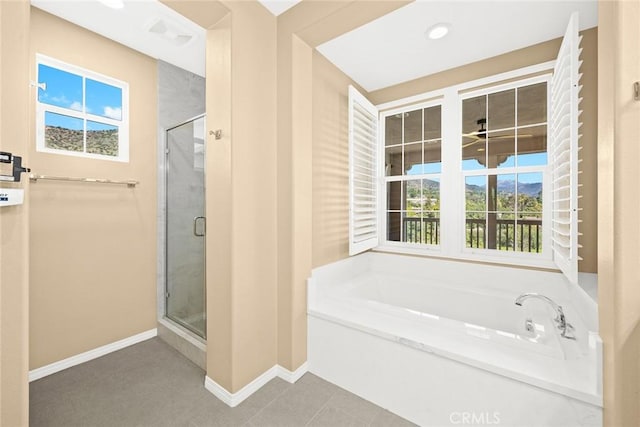 1252 N Lindley St, Azusa, CA 91702 - bathroom featuring a garden tub, healthy amount of natural light, a stall shower, and baseboards