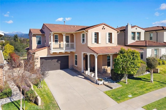 1252 N Lindley St, Azusa, CA 91702 - mediterranean / spanish home featuring stucco siding, an attached garage, driveway, a front yard, and stone siding