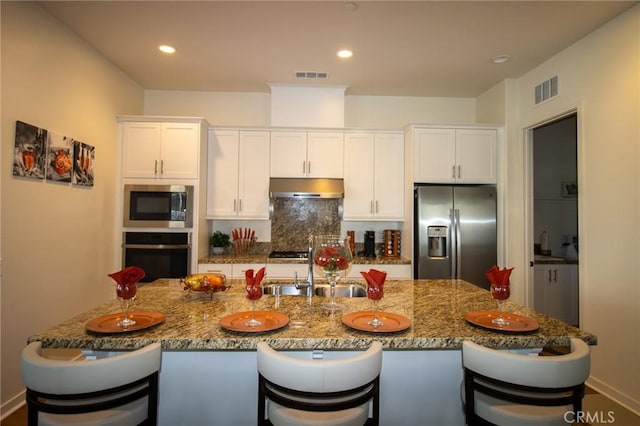 26694 Verdant Cir, Menifee, CA 92584 - kitchen with appliances with stainless steel finishes, under cabinet range hood, a sink, white cabinets, and recessed lighting
