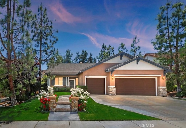 31159 Janelle Ln, Winchester, CA 92596 - single story home featuring a garage, stone siding, driveway, and a lawn