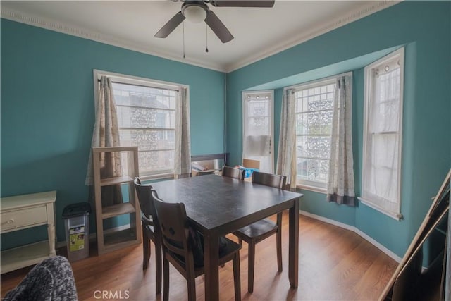 1248 E 65th St, Los Angeles, CA 90001 - dining area with ceiling fan, wood finished floors, crown molding, and baseboards