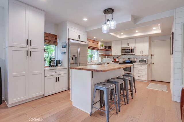 201 Todd Ct, Oceanside, CA 92054 - kitchen with appliances with stainless steel finishes, butcher block counters, light wood-style flooring, white cabinets, and recessed lighting