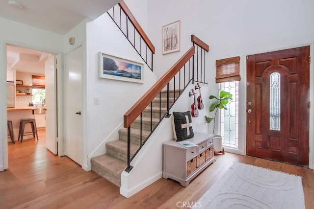 201 Todd Ct, Oceanside, CA 92054 - entryway featuring light wood-style floors, plenty of natural light, stairs, and a high ceiling