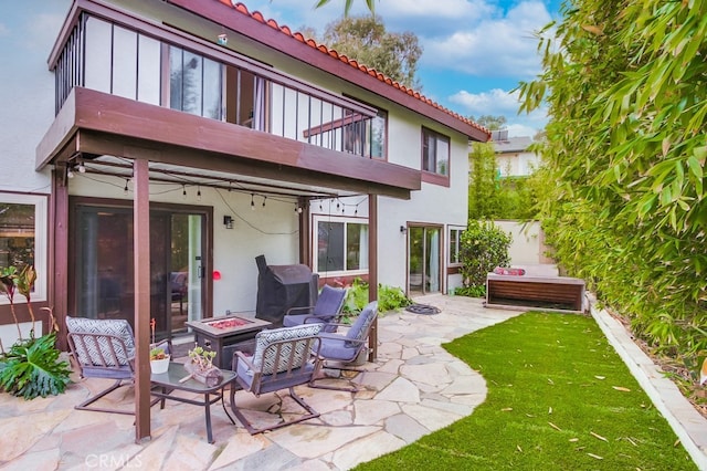 201 Todd Ct, Oceanside, CA 92054 - rear view of property with a balcony, a fire pit, stucco siding, a patio, and a tiled roof