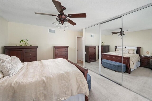 24214 Dalgo Dr, Valencia, CA 91355 - bedroom with light carpet, a closet, and a ceiling fan