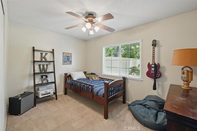 24214 Dalgo Dr, Valencia, CA 91355 - bedroom with light carpet, ceiling fan, and baseboards