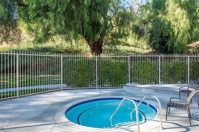 24214 Dalgo Dr, Valencia, CA 91355 - view of swimming pool featuring a hot tub and a patio