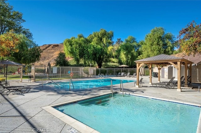24214 Dalgo Dr, Valencia, CA 91355 - community pool featuring a patio, a gazebo, and a mountain view