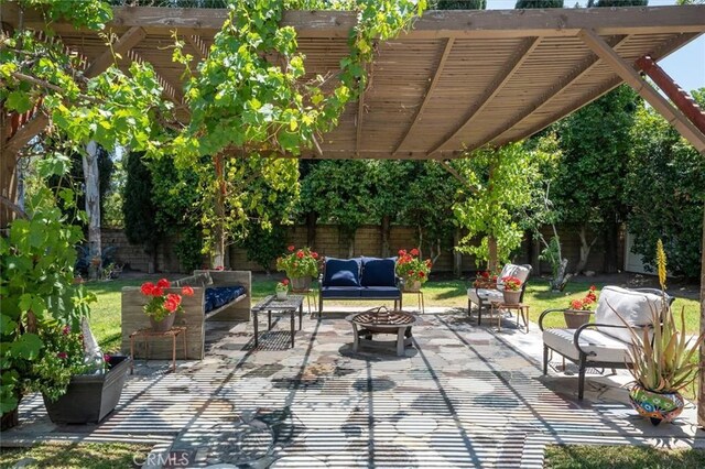 24214 Dalgo Dr, Valencia, CA 91355 - fenced backyard with outdoor lounge area, a pergola, and a patio