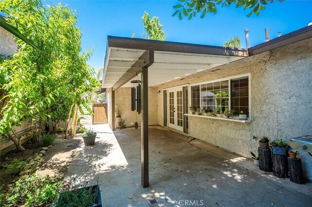 24214 Dalgo Dr, Valencia, CA 91355 - view of patio / terrace featuring french doors