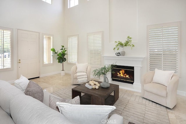 1019 N Sonora Cir, Orange, CA 92869 - living area featuring a glass covered fireplace and a high ceiling