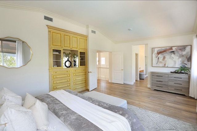 1019 N Sonora Cir, Orange, CA 92869 - bedroom featuring ornamental molding, vaulted ceiling, and light wood finished floors