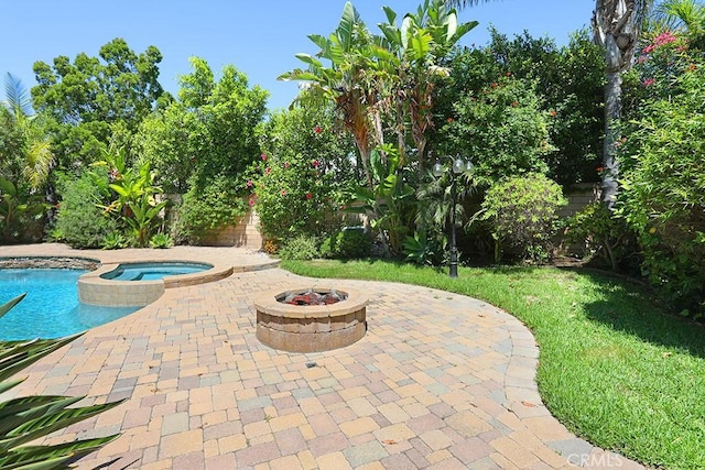 1019 N Sonora Cir, Orange, CA 92869 - view of swimming pool featuring a patio, a fire pit, a yard, and a pool with connected hot tub