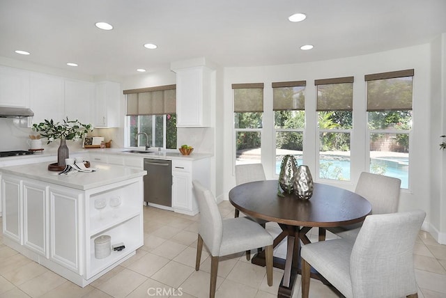 1019 N Sonora Cir, Orange, CA 92869 - kitchen with dishwasher, light countertops, plenty of natural light, white cabinets, and recessed lighting