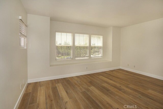 1019 N Sonora Cir, Orange, CA 92869 - spare room with wood finished floors and baseboards