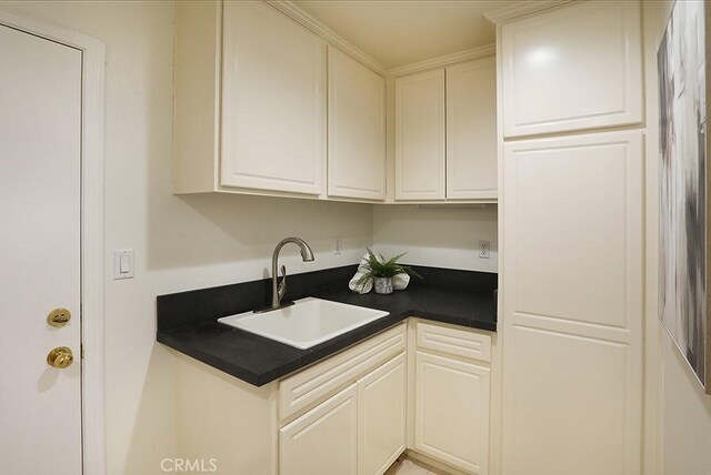 1019 N Sonora Cir, Orange, CA 92869 - kitchen featuring dark countertops and white cabinets