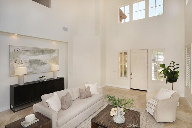1019 N Sonora Cir, Orange, CA 92869 - living room featuring a high ceiling and light tile patterned flooring