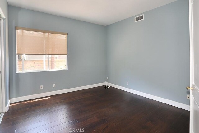 1019 N Sonora Cir, Orange, CA 92869 - empty room with baseboards and dark wood-style floors