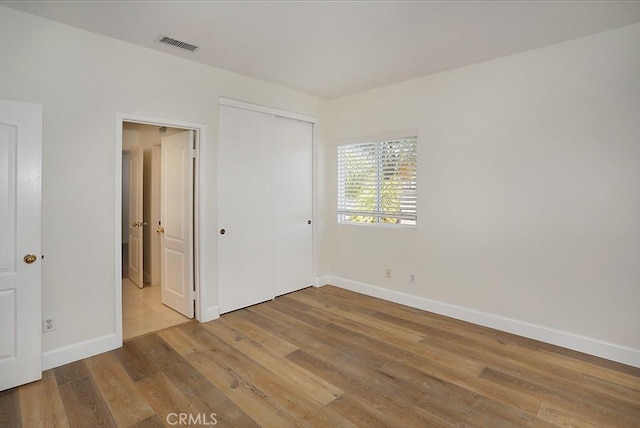 1019 N Sonora Cir, Orange, CA 92869 - unfurnished bedroom with wood finished floors and a closet