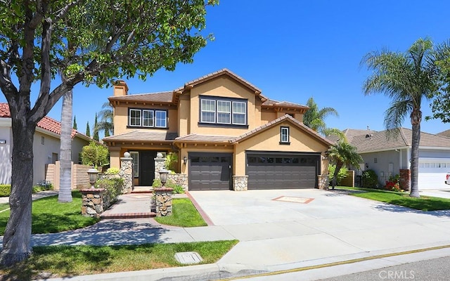1019 N Sonora Cir, Orange, CA 92869 - view of front facade with stucco siding, a chimney, concrete driveway, and an attached garage