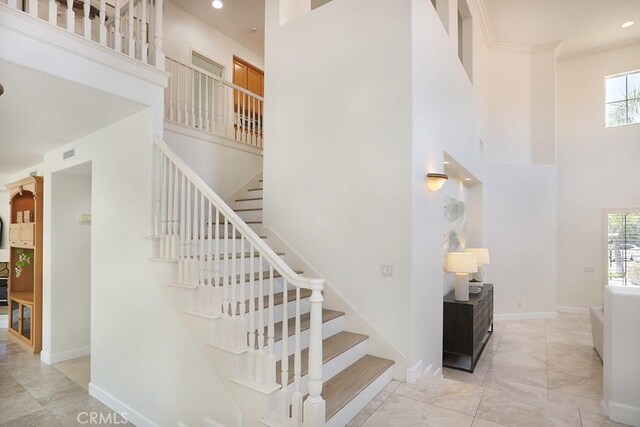 1019 N Sonora Cir, Orange, CA 92869 - staircase featuring a high ceiling, healthy amount of natural light, and recessed lighting