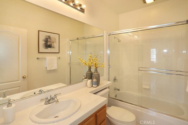 1019 N Sonora Cir, Orange, CA 92869 - bathroom featuring vanity and shower / bath combination with glass door