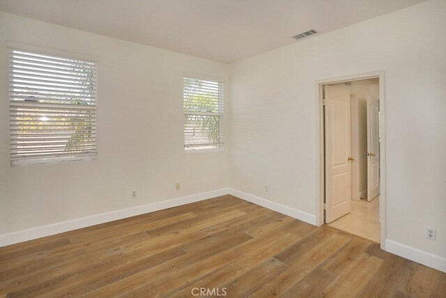1019 N Sonora Cir, Orange, CA 92869 - empty room featuring baseboards and light wood-style flooring