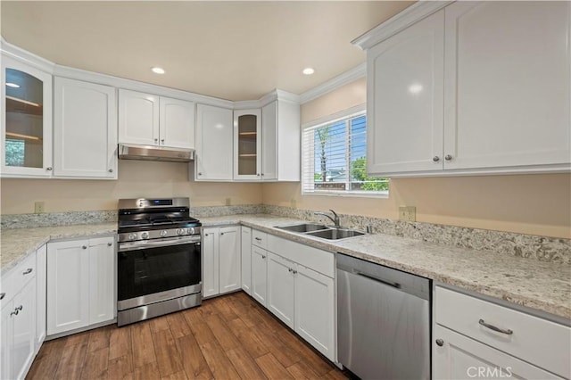 14230 Calahan St, Panorama City, CA 91402 - kitchen featuring stainless steel appliances, a sink, under cabinet range hood, white cabinets, and recessed lighting