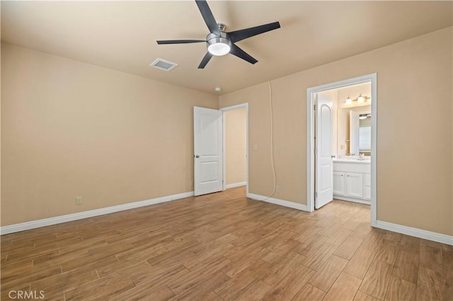 14230 Calahan St, Panorama City, CA 91402 - unfurnished bedroom featuring light wood finished floors, baseboards, and connected bathroom