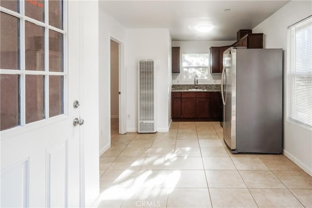3504 Minnesota Trl, Frazier Park, CA 93225 - kitchen with freestanding refrigerator, a heating unit, a sink, light tile patterned floors, and baseboards