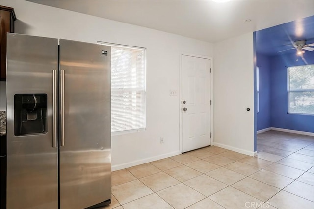 3504 Minnesota Trl, Frazier Park, CA 93225 - kitchen featuring stainless steel fridge with ice dispenser, light tile patterned floors, ceiling fan, and baseboards