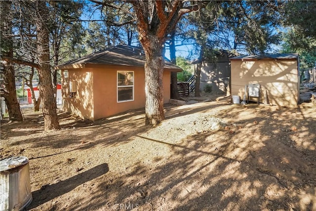 3504 Minnesota Trl, Frazier Park, CA 93225 - view of side of property featuring stucco siding and an outdoor structure