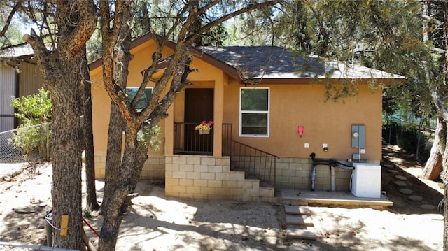 3504 Minnesota Trl, Frazier Park, CA 93225 - view of front of house with a shingled roof and stucco siding
