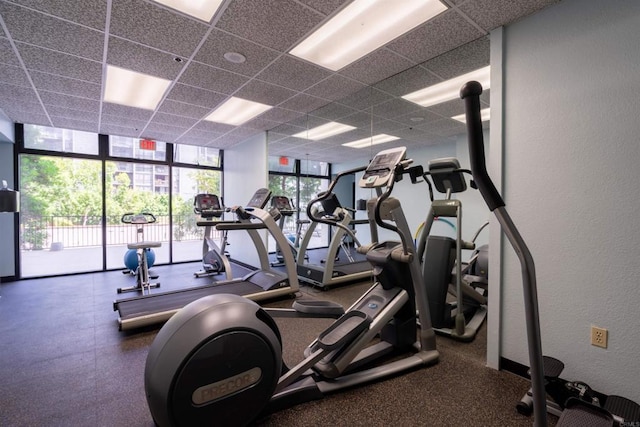 1333 8th Ave Unit 905, San Diego, CA 92101 - workout area with a drop ceiling, floor to ceiling windows, and a textured wall