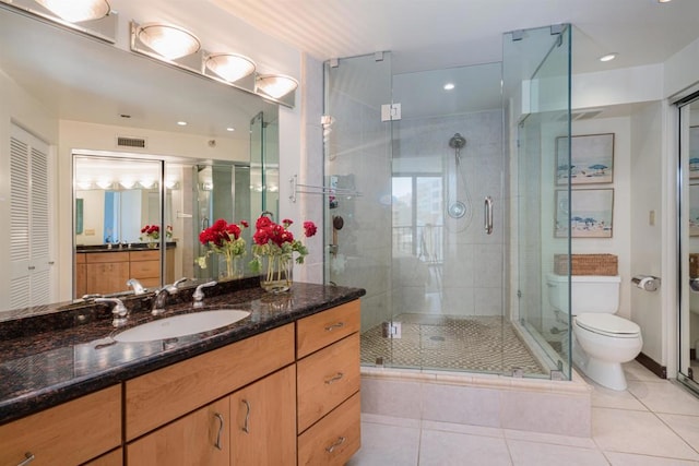 1333 8th Ave Unit 905, San Diego, CA 92101 - full bathroom featuring toilet, a shower stall, vanity, and tile patterned flooring