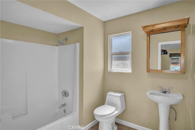 16410 Tish A Tang Rd, Lower Lake, CA 95457 - full bathroom with toilet, baseboards, shower / bath combination, tile patterned flooring, and a sink