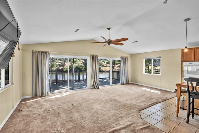 16410 Tish A Tang Rd, Lower Lake, CA 95457 - unfurnished living room with light carpet, ceiling fan, lofted ceiling, baseboards, and a water view