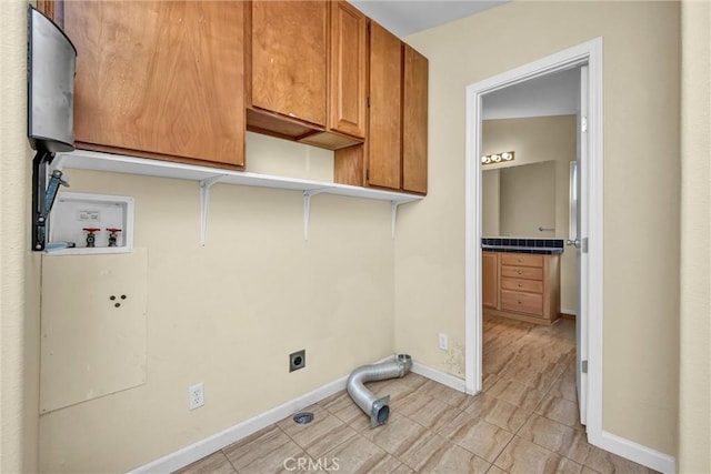 16410 Tish A Tang Rd, Lower Lake, CA 95457 - washroom featuring washer hookup, electric dryer hookup, cabinet space, baseboards, and light tile patterned floors