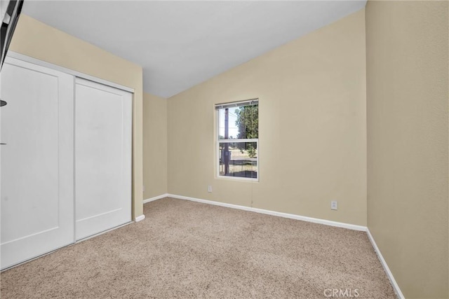 16410 Tish A Tang Rd, Lower Lake, CA 95457 - unfurnished bedroom featuring carpet, vaulted ceiling, baseboards, and a closet