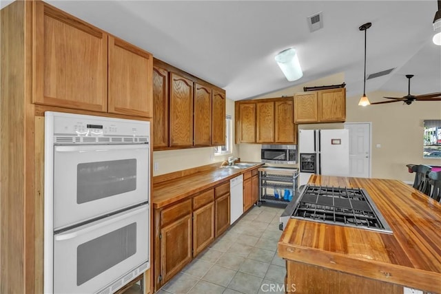 16410 Tish A Tang Rd, Lower Lake, CA 95457 - kitchen featuring butcher block counters, white appliances, lofted ceiling, light tile patterned floors, and ceiling fan