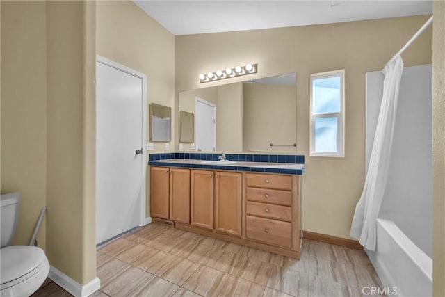 16410 Tish A Tang Rd, Lower Lake, CA 95457 - bathroom featuring toilet, vanity, shower / tub combo, and baseboards