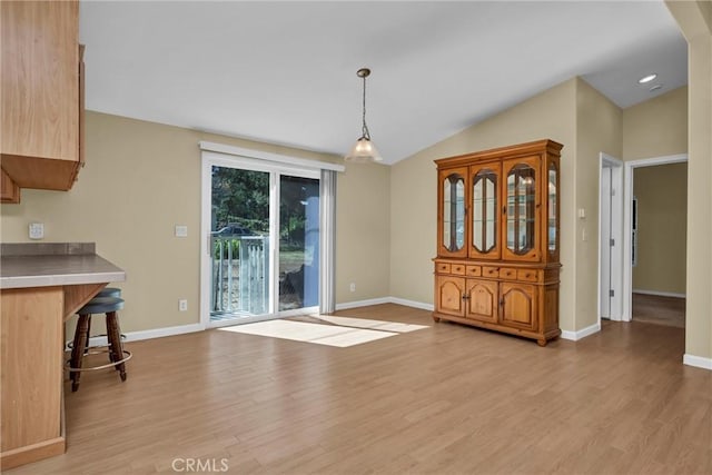 16410 Tish A Tang Rd, Lower Lake, CA 95457 - unfurnished dining area featuring light wood finished floors, baseboards, lofted ceiling, and recessed lighting