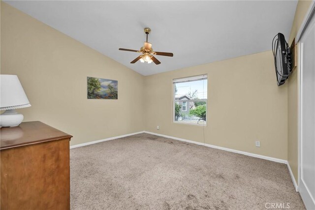 16410 Tish A Tang Rd, Lower Lake, CA 95457 - spare room with carpet, baseboards, vaulted ceiling, and ceiling fan