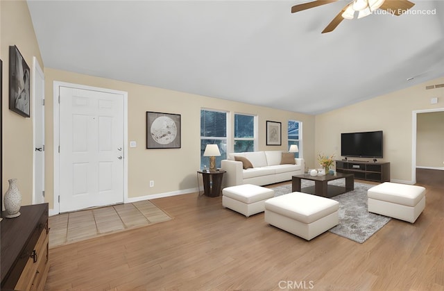 16410 Tish A Tang Rd, Lower Lake, CA 95457 - living area featuring vaulted ceiling, wood finished floors, a ceiling fan, and baseboards