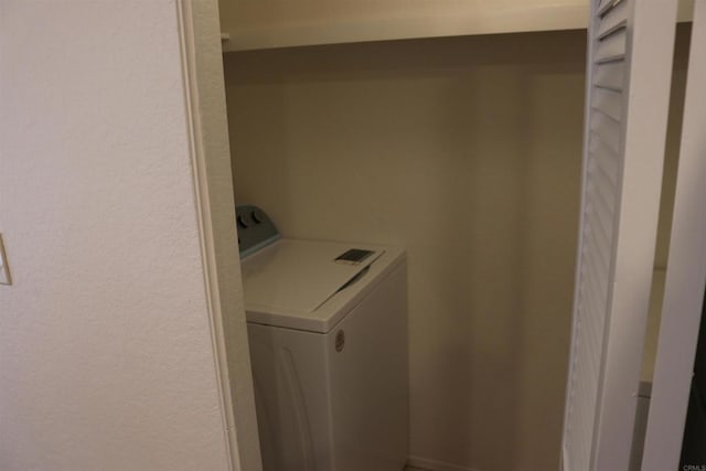 11215 Avenida De Los Lobos Unit F, Rancho Bernardo San Diego, CA 92127 - laundry room featuring washer / dryer and a textured wall
