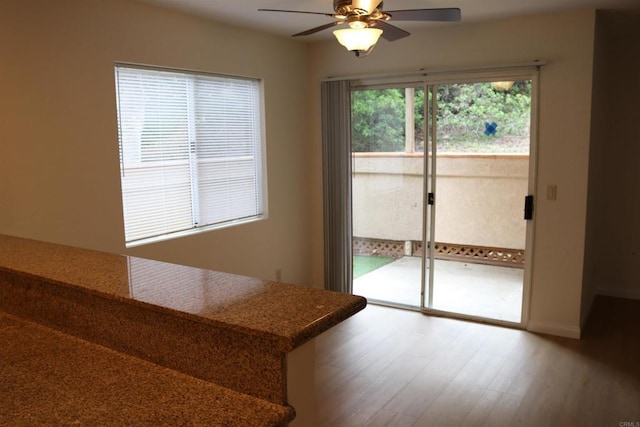 11215 Avenida De Los Lobos Unit F, Rancho Bernardo San Diego, CA 92127 - dining area with a ceiling fan, wood finished floors, and baseboards