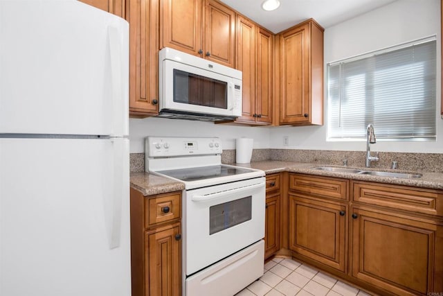 11215 Avenida De Los Lobos Unit F, Rancho Bernardo San Diego, CA 92127 - kitchen featuring white appliances, brown cabinets, light tile patterned flooring, light countertops, and recessed lighting