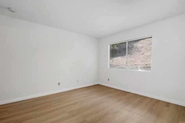 11215 Avenida De Los Lobos Unit F, Rancho Bernardo San Diego, CA 92127 - unfurnished room with light wood-style floors and a smoke detector