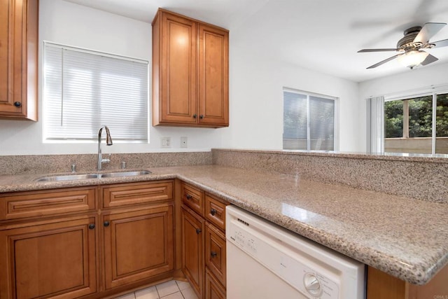 11215 Avenida De Los Lobos Unit F, Rancho Bernardo San Diego, CA 92127 - kitchen with dishwasher, brown cabinets, a ceiling fan, and light stone countertops